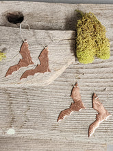 Load image into Gallery viewer, Copper bat earrings set: textured bat cutouts with silver-tone hooks on display.