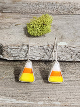 Load image into Gallery viewer, Candy corn drop earrings with orange, yellow, and white triangular charms on silver hooks.
