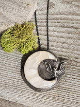 Load image into Gallery viewer, Banded agate moon-and-bat necklace with round pendant, black cord, silver-toned bezel