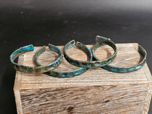 Load image into Gallery viewer, Copper blue patina bracelets, 1/4-in wide, three curved metal bangles on display