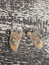 Load image into Gallery viewer, Pair of earrings with textured design on a textured surface