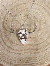 Load image into Gallery viewer, Silver-tone elk pendant necklace with brown-and-white mottled teardrop centerpiece