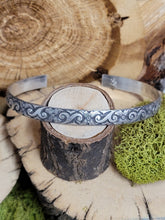 Load image into Gallery viewer, Metal fan-style cuff bracelet with decorative blue filigree pattern on silver band