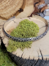 Load image into Gallery viewer, Silver metal cuff with ornate blue swirl filigree detail across the band