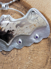 Load image into Gallery viewer, Silver bat-shaped pendant with purple amethyst stone eyes, close-up