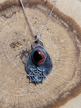 Load image into Gallery viewer, Silver-tone spider web necklace with oval dark stone pendant on teardrop bail