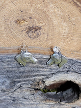Load image into Gallery viewer, Sterling silver horse head earrings with green enamel eyes and visible posts