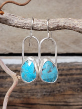 Load image into Gallery viewer, Turquoise teardrop facet stone earrings with curved silver hooks, close-up.