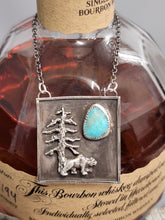 Load image into Gallery viewer, Silver square pendant necklace with tree-and-bear motif and turquoise teardrop inlay