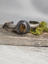 Load image into Gallery viewer, Silver-tone cowboy hat bracelet with tiger eye oval centerpiece on hinged cuff band