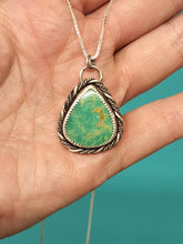 Load image into Gallery viewer, Turquoise teardrop pendant on silver rope chain in palm grip