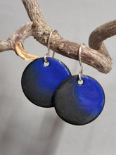Load image into Gallery viewer, Round enameled earrings with blue top discs and dark base, silver hook drops