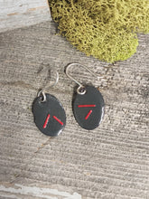 Load image into Gallery viewer, Grey enamel oval earrings with red marks and silver hooks, pair