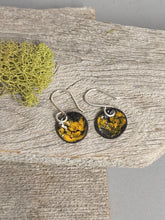 Load image into Gallery viewer, Pair of black and yellow swirled enamel round drop earrings with silver hooks