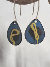 Load image into Gallery viewer, Pair of blue teardrop enamel drop earrings with yellow symbol and silver hooks