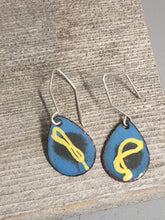 Load image into Gallery viewer, Blue teardrop enamel dangle earrings with yellow abstract symbol and silver hooks