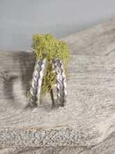 Load image into Gallery viewer, Silver zipper hoop stud earrings close-up, textured curved hoops with posts