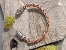 Load image into Gallery viewer, Twisted copper cuff bracelet with braided copper coil and engraved silver charm bead