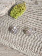 Load image into Gallery viewer, Clover drop earrings with pale gray chalcedony petals and silver fishhook backs on wood