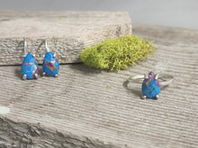 Load image into Gallery viewer, Silver hoop earrings with blue turquoise teardrop stones, angled view