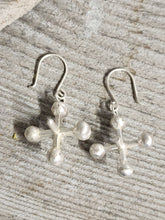 Load image into Gallery viewer, Silver-tone cross drop earrings with round bead accents and fishhook backs
