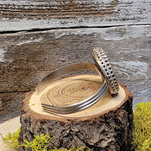 Load image into Gallery viewer, Silver cuff bracelet with oval blue stone top and textured side setting