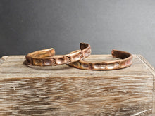 Load image into Gallery viewer, Copper textured cuff bracelet, 1/4 inch wide, raised oval embossing, two shown
