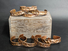 Load image into Gallery viewer, Copper textured bracelet, 1/2" wide, patterned hammered cuff with curled ends.
